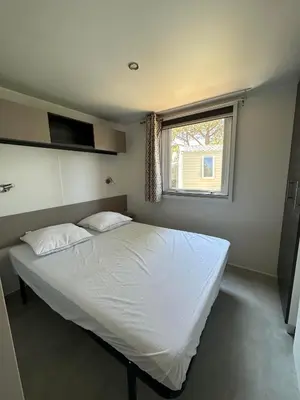 Un ou plusieurs lits dans un hébergement de l'établissement Camping 4 étoiles Le bois dormant