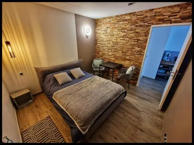 Un ou plusieurs lits dans un hébergement de l'établissement Chambre proche Puy du fou entrée indépendante, Encas du matin Offert